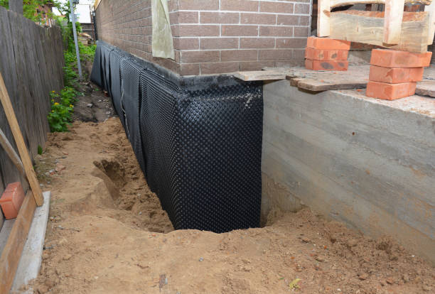 Happy homeowners after waterproofing job in Tontogany